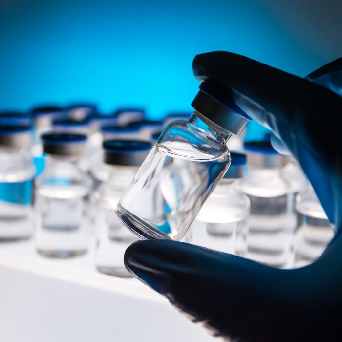 Group of Vaccine bottles. Medicine in ampoules. Glass vials for liquid samples in laboratory.
