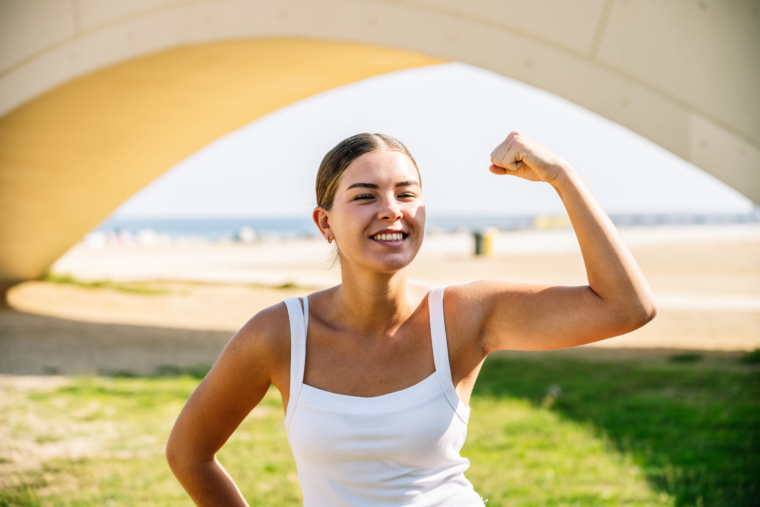 Woman demonstrating strength and vitality, representing the benefits of healthy sleep, stress management, and balanced hormones.
